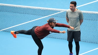 Naomi Osaka does stretching exercises. Getty Images