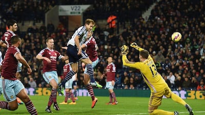 Craig Dawson of West Brom heads and scores the opening goal past Adrian of West Ham during his side's 2-1 loss on Tuesday in the Premier League. Ross Kinnaird / Getty Images