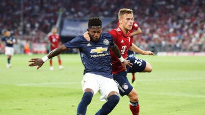 Bayern Munich's Joshua Kimmich challenges Manchester United's Fred. Getty Images