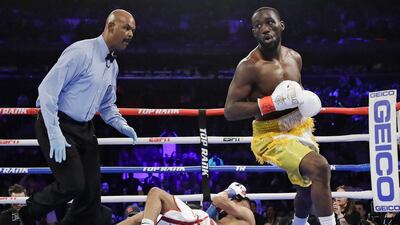 Terence Crawford, right, reacts after knocking down Amir Khan during the first round. AP Photo