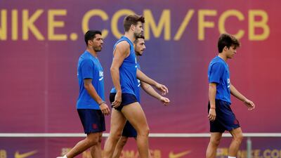 Barcelona's Gerard Pique and Luis Suarez during training. Reuters