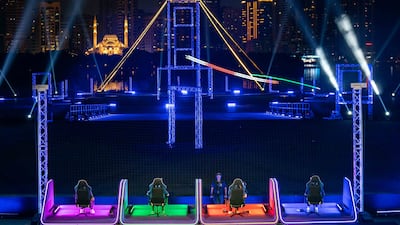 Pilots navigate the LED line course at Al Majaz Amphitheatre during one of the matches