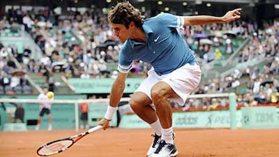 Federer returns to Robin Soderling during his eventual loss that stopped his run of 23 straight semi-final appearances.