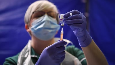 Staff prepare to give vaccinations to patients at Bournemouth International Centre, England. Getty Images