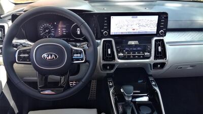 The cabin includes a 10.25-inch touchscreen and Bose sound system with Android Auto and Apple CarPlay, plus a panoramic sunroof