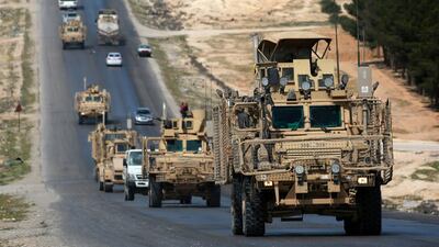 US-backed coalition forces driving in the northern Syrian town of Manbij. Delil Souleiman / AFP
