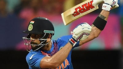 India’s Virat Kohli plays a shot during the World T20 cricket tournament semi-final match between India and West Indies at The Wankhede Cricket Stadium in Mumbai on March 31, 2016. / AFP / PUNIT PARANJPE