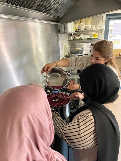 Migrant entrepreneurs make a batch of rose cordial. Photo: Laura Llamas