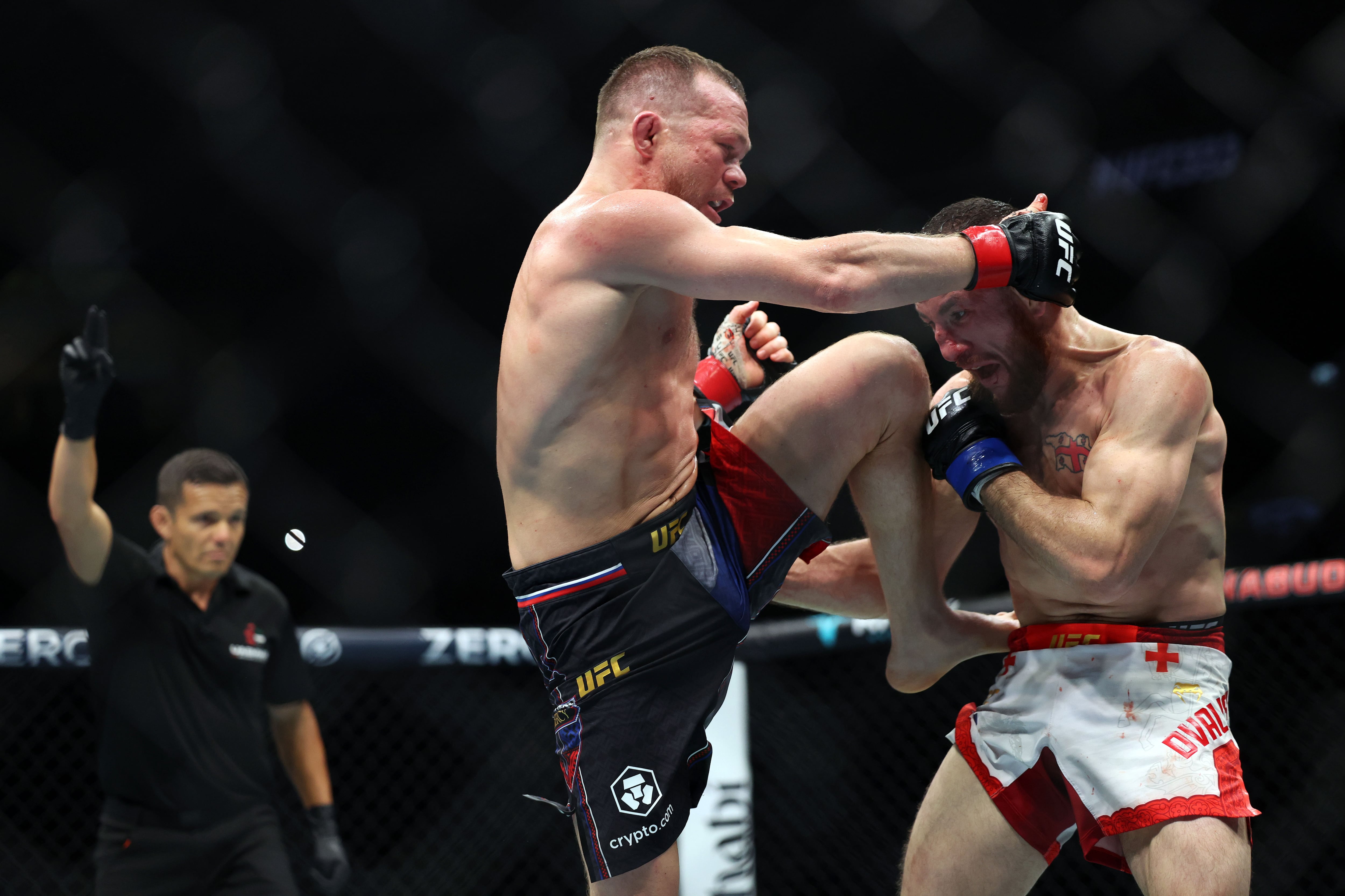 Petr Yan lands a knee to the face of Merab Dvalishvili. Chris Whiteoak / The National