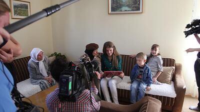 Dr Aysha Al Dhaheri (left) of the UAE Armed Forces is reunited with Fatima Elezi. Dr Al Dhaheri helped deliver Fatima when she was born in a refugee camp Albania in May of 1999. Photo Courtesy Nomad Productions