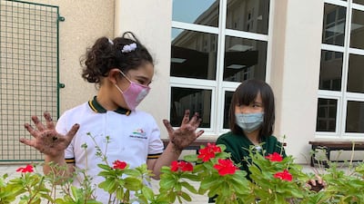 Building your own vegetable garden, such as these Year 2 pupils at Deira International School are, is just one way of keeping children occupied. Courtesy: Claire Heylin
