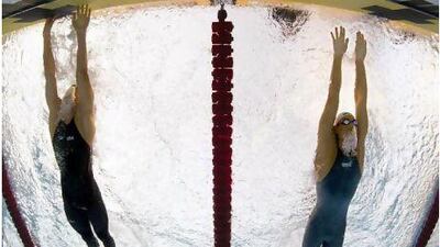 Michael Phelps, left, beats Milorad Cavic in the 100m butterfly final at the swimming world championships in Rome in 2009.