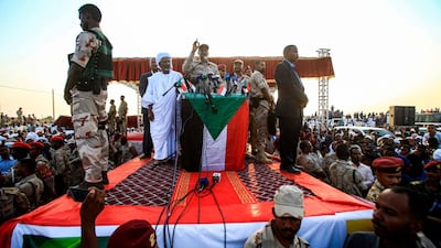 Mohamed Hamdan Dagalo (C), also known as Himediti, deputy head of Sudan's ruling Transitional Military Council (TMC) and commander of the Rapid Support Forces (RSF) paramilitaries, gives a speech in the village of Qarri, about 90 kilometres north of Khartoum. AFP