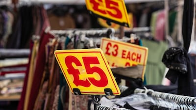 Clothing price labels at a market stall in London. Inflation fell to 3.4% in February from 4% the previous month. Bloomberg