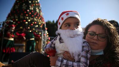 Palestinians visit the Christmas market at the Manger Square in Bethlehem. EPA
