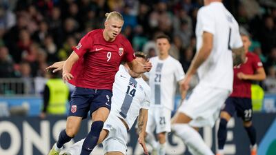 Erling Haaland skips a challenge from Slovenia's Jasmin Kurtic. AP