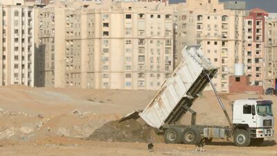 Construction staff at the newly built section of a new axis and bridge of Hasaballah El-Kafraway in Zahraa El Maadi to connect the ring road in the district of Maadi, Cairo. Reuters