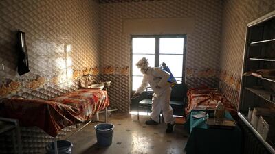 A member of the Syrian Civil Defence a makeshift hospital room in Dana, Syria, on March 22, 2020. AFP