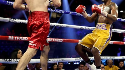 Subriel Matias (R) exchanges punches with Petros Ananyan during their super lightweight bout at MGM Grand Garden Arena in Las Vegas. AFP