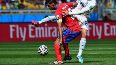 England midfielder Adam Lallana, right, vies for the ball against Costa Rica forward Bryan Ruiz during their match on Tuesday at the 2014 World Cup in Belo Horizonte, Brazil. Ronaldo Schemidt / AFP