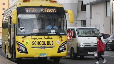 A school bus in Najda Street in Abu Dhabi on May 26, 2014. Some survey respondents called for the introduction of exterior signs on buses that would force traffic to stop to allow children to board or get off a bus. Delores Johnson / The National