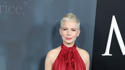 Clad in a red creation by Louis Vuitton for the 'All the Money in the World' premiere in Beverly Hills on December 18, 2017. EPA