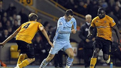 Adam Johnson, centre, was praised by his Manchester City manager Roberto Mancini, but the Italian was also critical of some aspects of his game.
