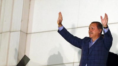Recep Tayyip Erdogan waves at the crowd as he celebrates his election victory in Ankara. Umit Bektas / Reuters