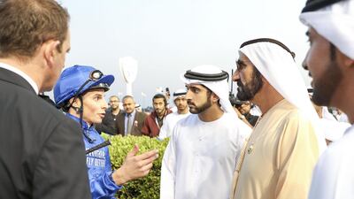Sheikh Mohammed bin Rashid speaks with jockey William Buick.
