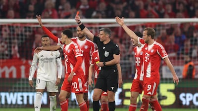 Referee Slavko Vincic shows a red card to Real Madrid substitute Eduardo Camavinga (not pictured). Getty Images