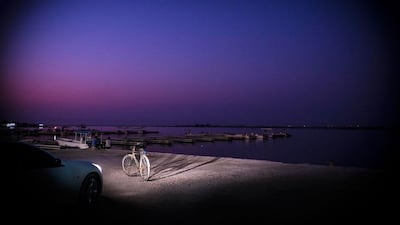 Al Rams harbour after sunset.