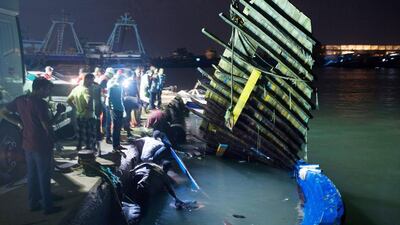 Rescuers remove the bodies of drowned migrants who were trapped in the bottom of a boat in Zuwara, Libya. (AP Photo/Mohamed Ben Khalifa)
