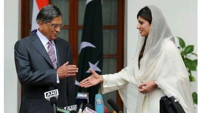 Pakistan's foreign minister, Hina Rabbani Khar, shakes hands with the Indian foreign minister, SM Krishna, before a meeting in New Delhi yesterday that was looking to breathe fresh life into a peace process still stifled by the trauma of the 2008 Mumbai attacks. Prakash Singh / AFP Photo