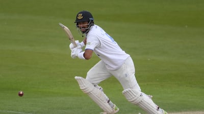Cheteshwar Pujara of Sussex takes a quick single to reach his century against Durham. Getty