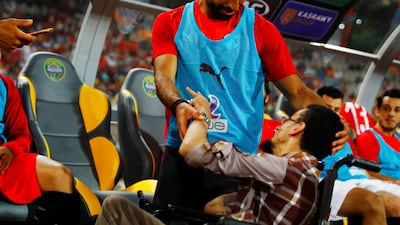 Egypt's star forward Mohamed Salah greets a fan before a friendly match against Tanzania in Alexandria on June 13, 2019. Reuters