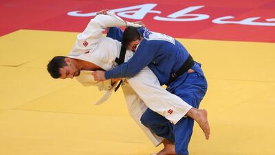 Sergiu Toma, left, in action during the IJF World Judo Tour Grand Slam Abu Dhabi tournament on Saturday. Adel Al Naimi / Aletihad / October 29, 2016