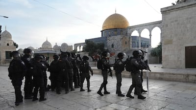 Israeli police in riot gear enter the Al Aqsa Mosque compound. Officers fired rubber bullets and stun grenades at Palestinian protesters. AP