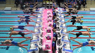 Competitors in the men's 50-metre butterfly final on day six of the Commonwealth Games in Glasgow. AFP