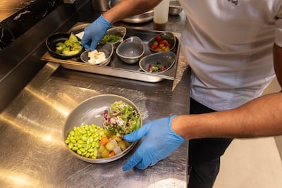 Chef Rakish prepares a poke bowl. Antonie Robertson/The National