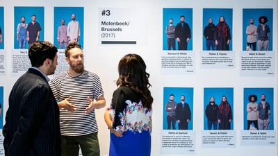 Curd Maeseele, a participant in the Hipster/Muslim Project, talk to people at the exhibition at Nasab Dubai. Courtesy: Nasab Dubai