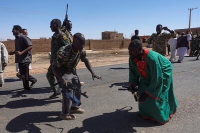 Sudan's army soldiers celebrate the liberation of an oil refinery in north Bahri on January 25. Reuters