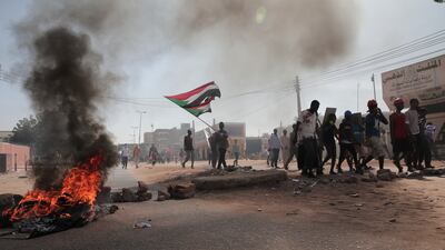 Sudanese demonstrators march in Khartoum, Sudan to protest a deal signed between the country's main pro-democracy group and its ruling generals, who seized power in an October 2021 coup. AP
