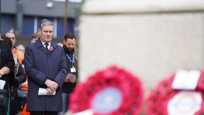 Labour Party leader Sir Keir Starmer joins a memorial service outside Euston railway station in London. PA
