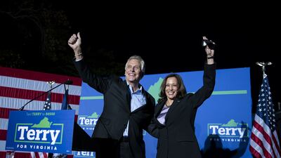 Terry McAuliffe, Democratic gubernatorial candidate for Virginia, and US Vice President Kamala Harris, wave during a campaign event in Dumfries, Virginia, US, on October 21, 2021. Bloomberg