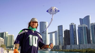 A visitor flies a kite.