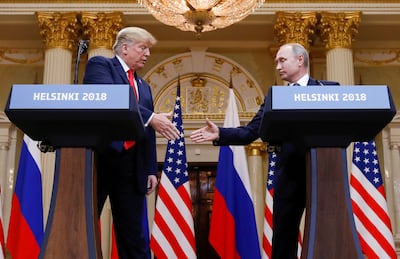 President Donald Trump and Russia's President Vladimir Putin shake hands during a joint news conference after their meeting in Helsinki. Reuters