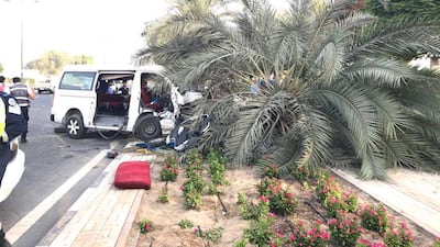 The mini bus driver lost control and swerved on Zabeel Street and hit a tree. Courtesy Dubai Police