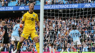 Burnley goalkeeper Joe Hart reacts after Leroy Sane, right, scores Manchester City's fifth goal. EPA