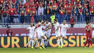 Jordan players celebrate scoring the opening goal in the 1-1 draw.