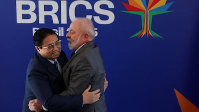 Mr da Silva with Vietnam Prime Minister Pham Minh Chinh. Reuters